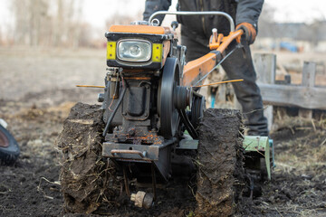 Fototapeta premium Garden tiller to work, walk-behind tractor