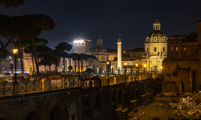 Fototapeta na wymiar Trajan's Column, Church of Saint Mary of Loreto and Church of the Most Holy Name of Mary at the Trajan Forum at Night