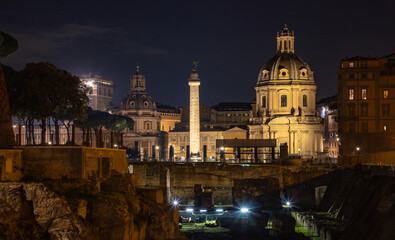 Fototapeta na wymiar Trajan's Column, Church of Saint Mary of Loreto and Church of the Most Holy Name of Mary at the Trajan Forum at Night