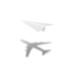 White paper plane casting shadow of airplane on white background. Concept for travel, business...