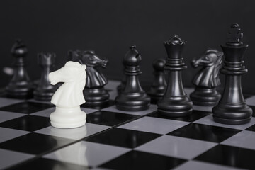 chess game.business leader concept.Selective focus.on a dark background.