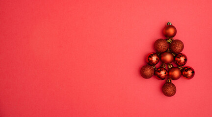 New Year mock up blank template design idea. Christmas tree made of red decorative balls mockup against pastel pink background. Copy space templates designs for new year message layout. Noel.
