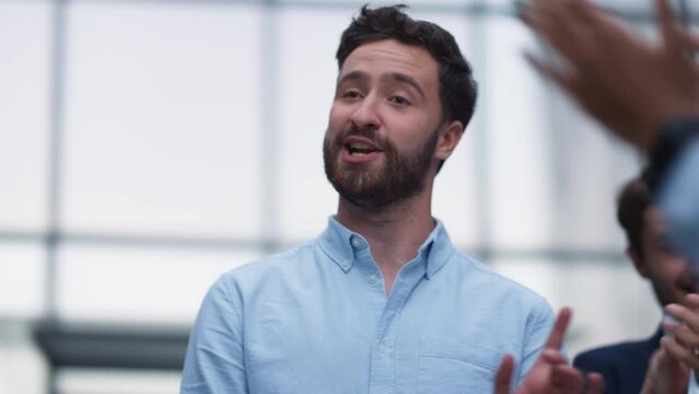 Portrait happy leader talking encouraging team outside office. Work appreciation