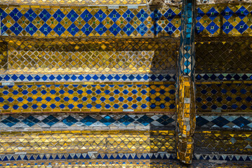 Colorful mosaic art pattern decoration background. Texture surface from detail of old Thai art architecture background concept.