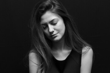 Naklejka premium Beauty portrait of a beautiful girl with makeup and long hair