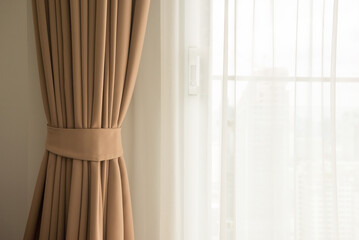 Curtain in bedroom with morning sunlight. Interior decoration concept