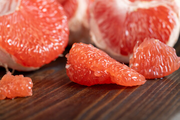red ripe grapefruit on a cutting board