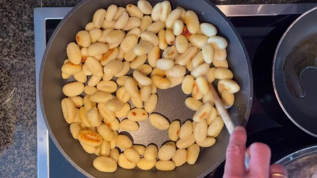gnocchi potato fry in pan fresh portion healthy meal food diet snack on the table copy space food background rustic top view