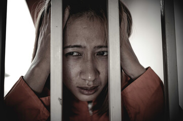 Hands of women desperate to catch the iron prison,prisoner concept,thailand people,Hope to be...