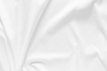 White fabric texture background. Cloth soft wave. Creases of satin, silk, and cotton.