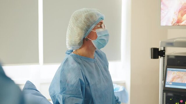 Process of Gynecological surgery operation. Female doctors performing gynecological operation at the hospital healthcare medicine gynecology treatment curing help assistance experience. Real scene.
