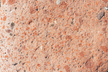 Natural stone textured horizontal background in red and orange colors. 