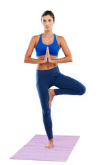 Perfect balance. Portrait of a sporty young woman practising yoga against a white background.
