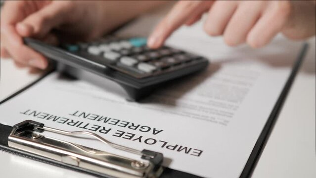 employee retirement agreement. An HR employee sends an employee into retirement. Staff reduction. Resignation.