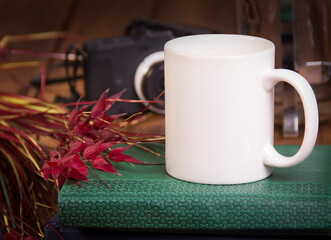 white mug on a wooden table mockup
