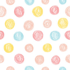 Seamless pattern with polka dots in pastel colors.