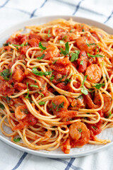 Homemade One-Pot Garlic Tomato Shrimp Pasta on a Plate, side view.