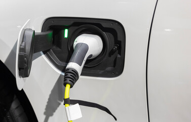 Power cable pump plug in charging power to electric vehicle EV car