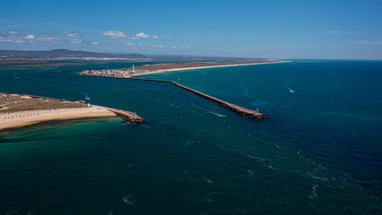Fototapeta premium wide view of lighthouse in Ilha Deserta of Algarve