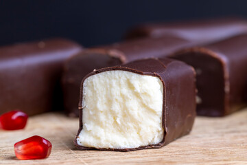 dessert of creamy filling and chocolate on a board