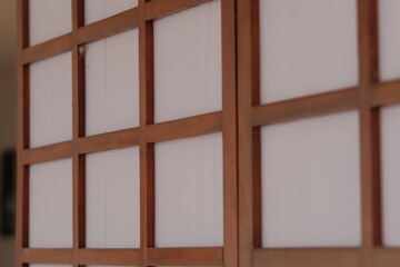 wooden window with shutters on white