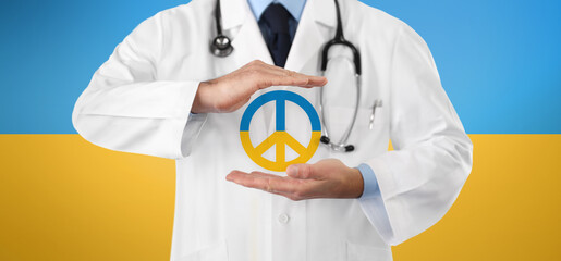peace and stop the war in Ukraine, medical aid concept, close-up of doctor hands showing the symbol...