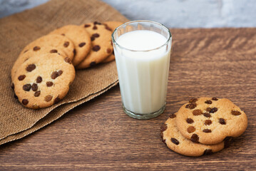 Fragrant, tasty, homemade cookies with raisins and a glass of fresh milk on the table. Delicious, hearty, healthy breakfast. Copy space, high resolution