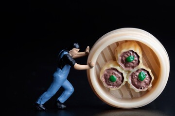 miniature figurine of a man with food