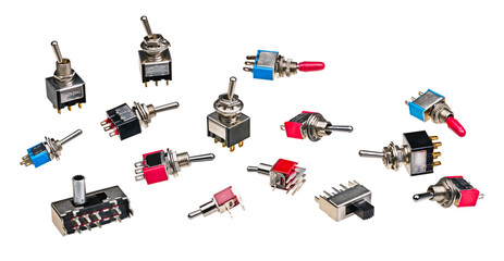 Different types of electrical toggle switches isolated on a white background. Collection of...