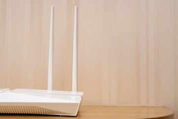 a white wifi router on a table