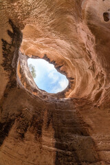 Cave in the Grand Canyon. An ancient cave. Natural window made of stone. eroded cave