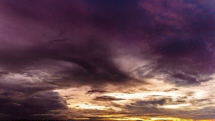 Dramatic sunset in the Sky through cumulus storm clouds, Timelapse. Awesome epic landscape. Amazing vibrant colors, in Goiania, Brazil