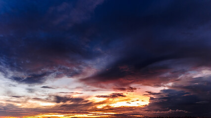 Dramatic sunset in the Sky through cumulus storm clouds, Timelapse. Awesome epic landscape. Amazing vibrant colors, in Goiania, Brazil