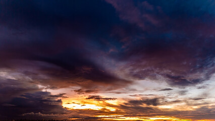 Dramatic sunset in the Sky through cumulus storm clouds, Timelapse. Awesome epic landscape. Amazing vibrant colors, in Goiania, Brazil