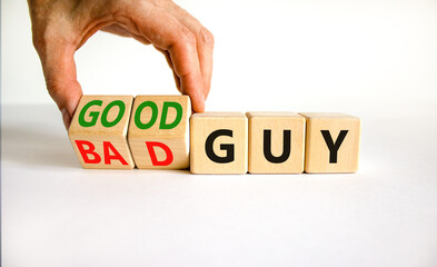 Good or bad guy symbol. Businessman turns cubes and changes concept words Bad guy to Good guy....
