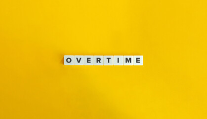 Overtime Word on Letter Tiles on Yellow Background. Minimal Aesthetics.