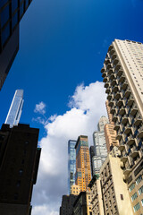 Fototapeta na wymiar Newly built ultra luxury high-rise residential buildings stand among Midtown Manhattan skyscraper on November 03, 2021 in New York City NY USA.