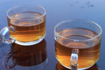 Beautiful morning background with coffee or tea cups closeup view.	