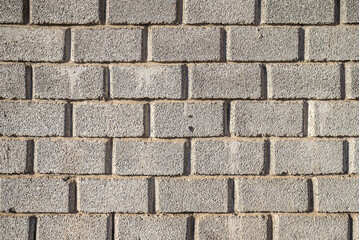 Gray cinder block wall surface as background