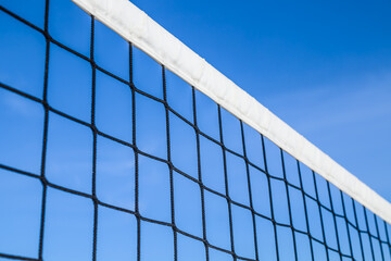Volleyball net close-up against the sky