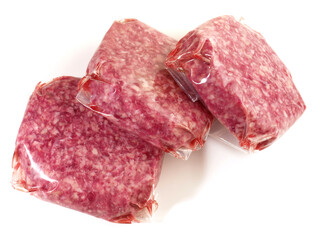 Beef Meat Patties in Vacuum Bags isolated on white Background
