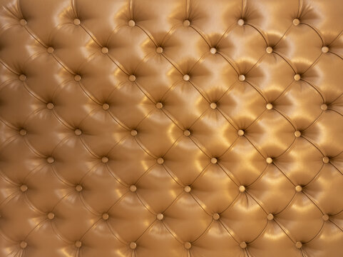 Texture of brown beige leather background with capitone pattern, full-frame. Brown retro Chesterfield style.