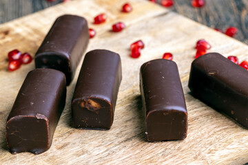 dessert of creamy filling and chocolate on a board