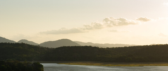 Sunset over a lake in a tropical landscape