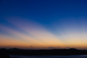 Sunset over a lake in a tropical landscape