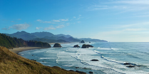 View of the ocean coastline near Cannon Beach in Oregon form viewpoint in the Ecola State Park. © thecolorpixels