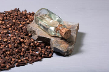 clove grains and a bottle of clove oil. For dieters