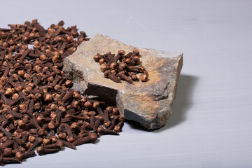 fragrant clove grains on the stone