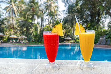 softdrinks with blur resort swimmingpool in background