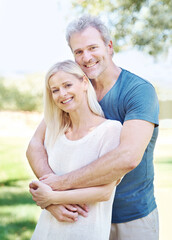 Obraz premium They mean the world to each other. A lovely mature couple enjoying a day out together in the park.